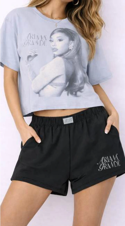 Ariana Grande portrait top and black shorts.